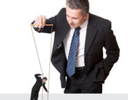 Wrongful Dismissal by Employer -- Employer Playing with Employee on puppet strings