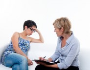 Psychiatrist woman attending a depressed woman who has been terminated