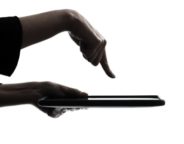 Social Media Use Discriminatory -- woman hand computer computing typing digital tablet silhouette